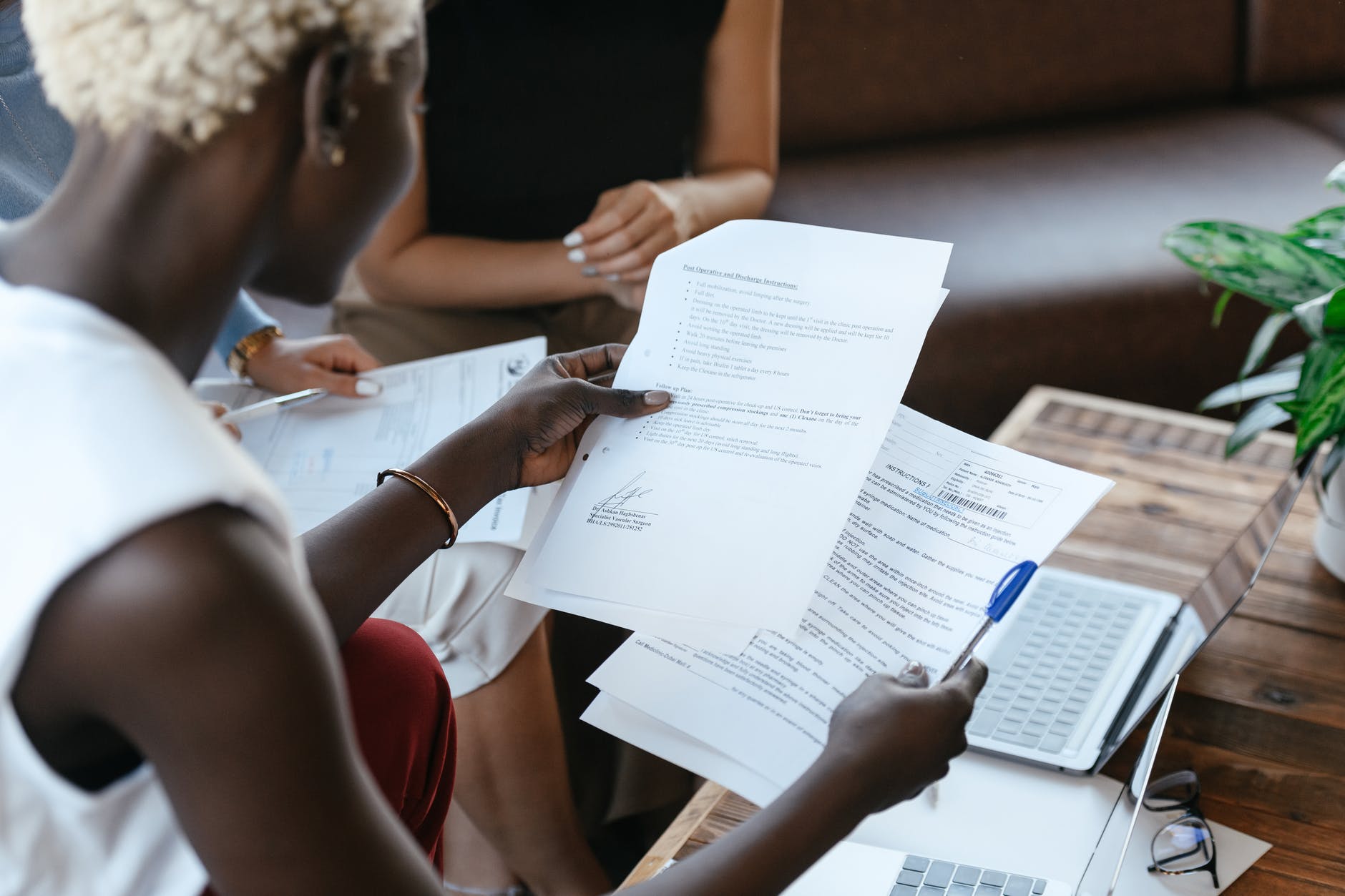 black woman reading information of important document